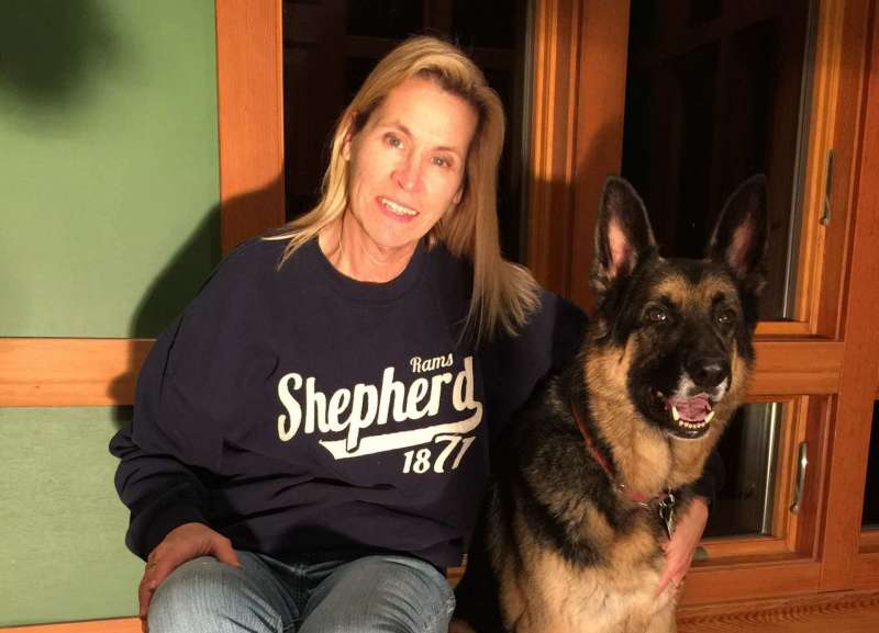 Valerie Owens ¹76 and ¹86, Executive Director of University Communications, and her German shepherd, Sabot.