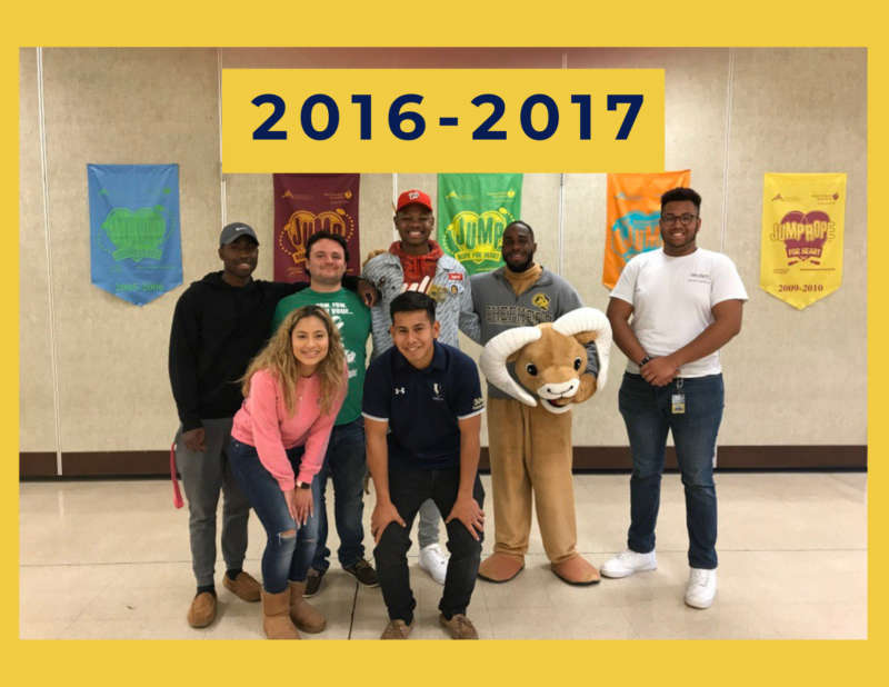 yellow background, in the center is a group of students standing side by side in front of a wall with posters on it, and above in the center reads "2016-2017"
