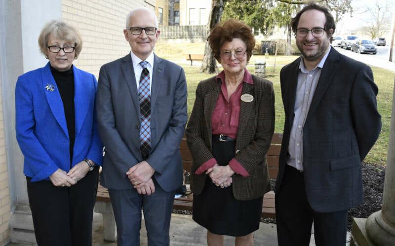Group photo outside White Hall with Ann Legreid, David Fearn, Sylvia Shurbutt, and Sam Greene.