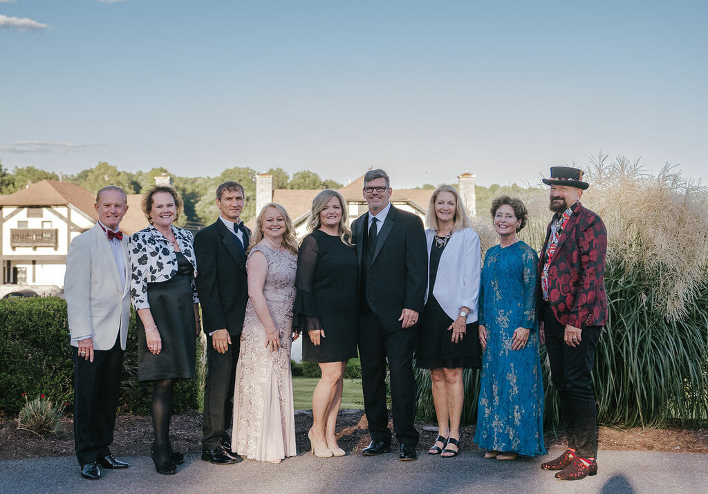 Photo of Gala presenting sponsore standing outside at the Bavarian Inn on a nice evening.