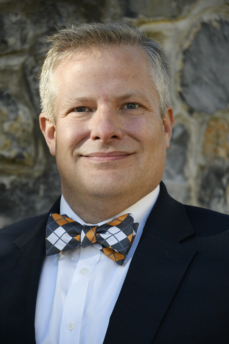 Headshot of Scott Barton smiling and looking at the camera.
