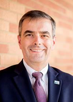 Headshot of James Taylor.