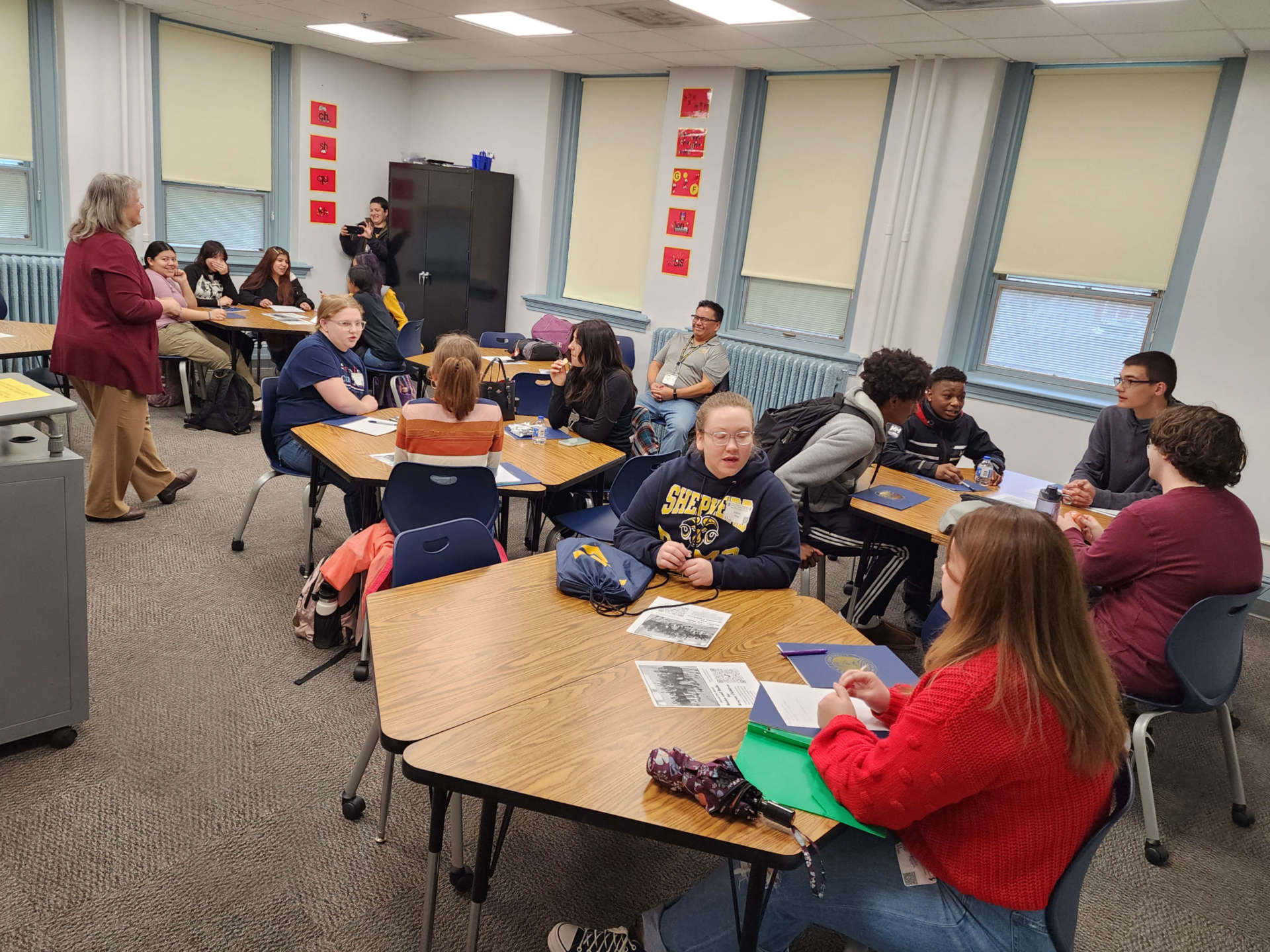 High school students in a classroom attending School of Education open house.