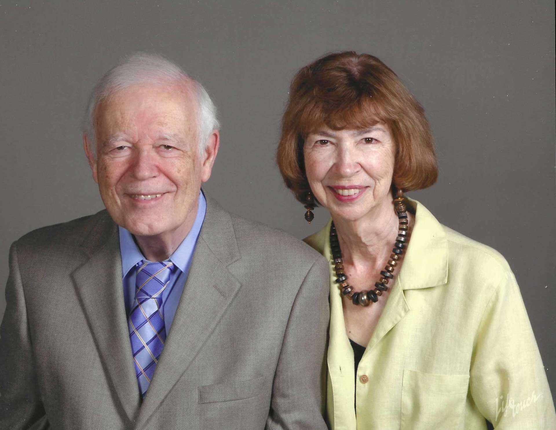 Photo of Jack and Pat Egle standing together, dressed nicely, smiling and looking at the camera.