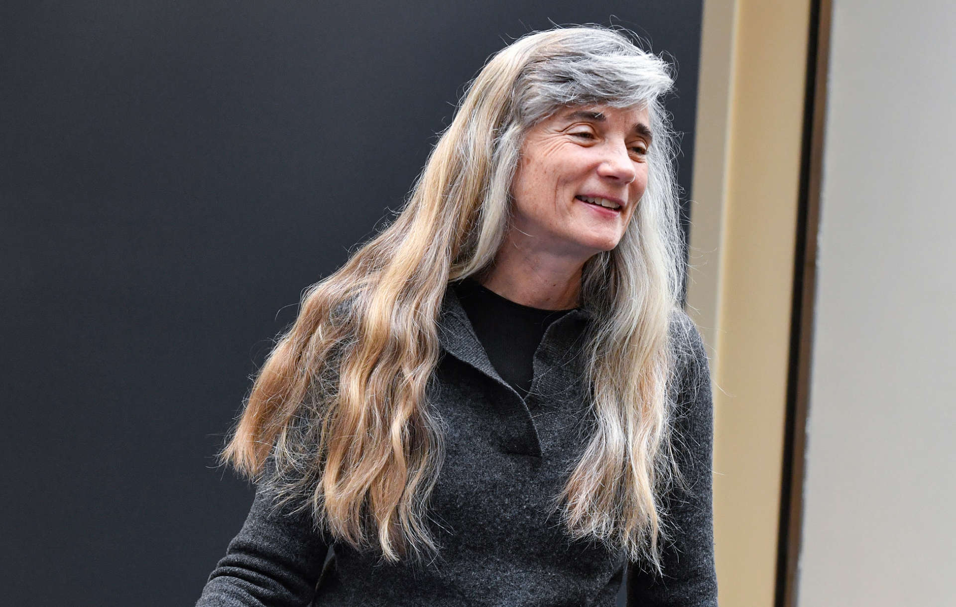 Photo of Ann Pancake smiling and looking off to the side.