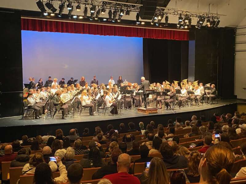 Photo of high school students performing on Frank Center Theater stage during honor concert.