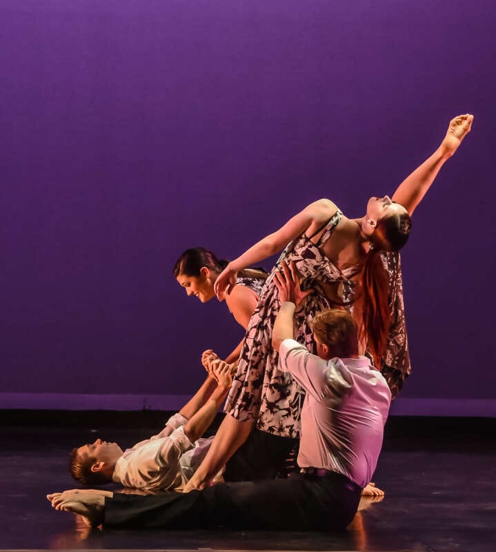 Photo of West Virginia Dance Company dancers performing on stage.